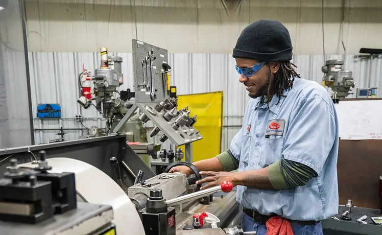 Worker operating a machine